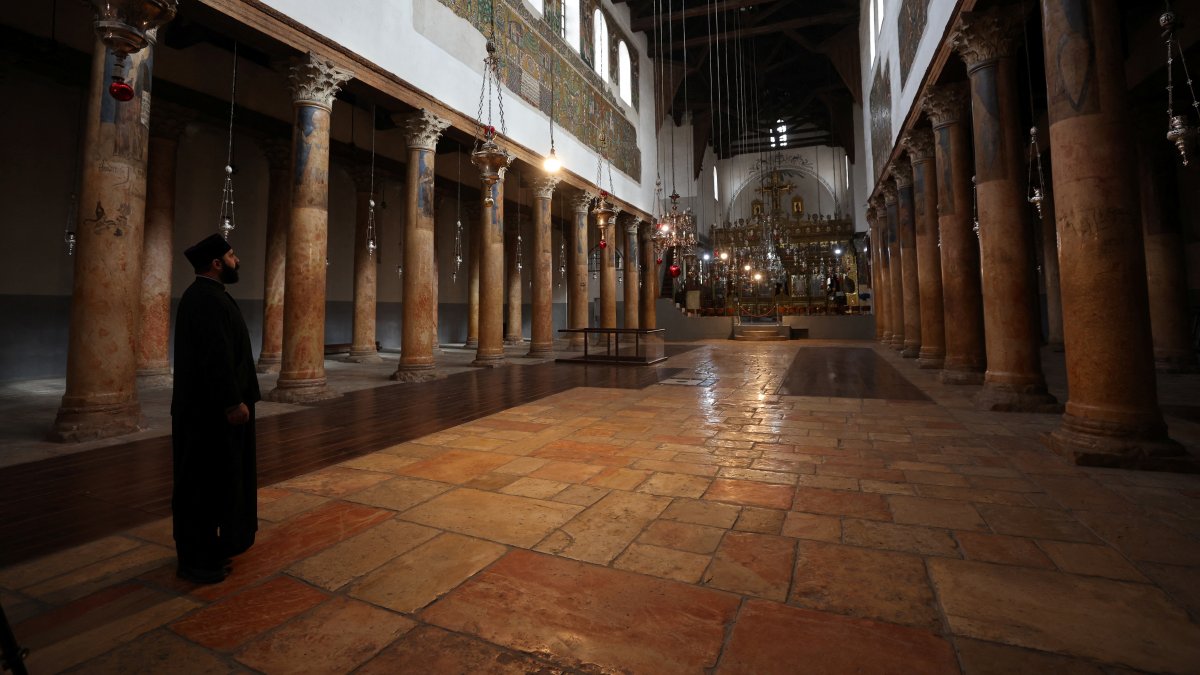 Orthodox priest Issa Thaljieh stands in the Church of the Nativity as no tourists are seen in Bethlehem in the Israeli-occupied West Bank, Palestine, Nov. 25, 2024. (Reuters Photo)