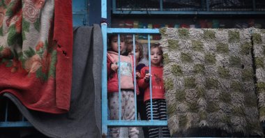 Children stand on the balcony at a school housing displaced Palestinians in the Nuseirat camp, central Gaza, Palestine, Nov. 27, 2024. (AFP Photo)