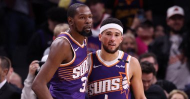 Suns Kevin Durant hugs teammate Devin Booker after the Suns defeated the Golden State Warriors 113-105, in Phoenix, Arizona, Nov. 30, 2024. (AFP Photo)