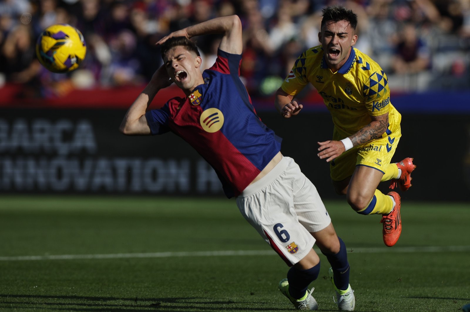 FC Barcelona&#039;s Gavi (L) vies for the ball with Las Palmas&#039; Alberto Moleiro during the La Liga match in Barcelona, Spain, Nov. 30, 2024. (EPA Photo)