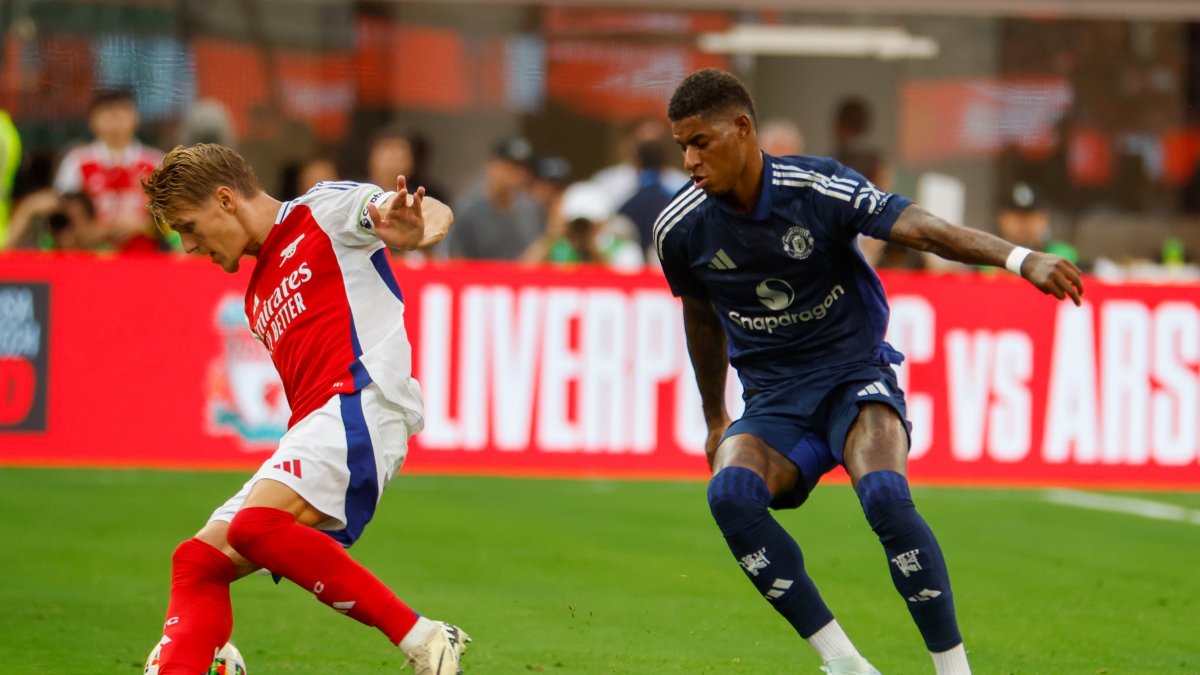 Arsenal&#039;s Martin Odegaard (L) in actions against Manchester United&#039;s Marcus Rashford during a friendly football match at Sofi Stadium, Inglewood, California, U.S., July 27, 2024. (Shutterstock Photo)