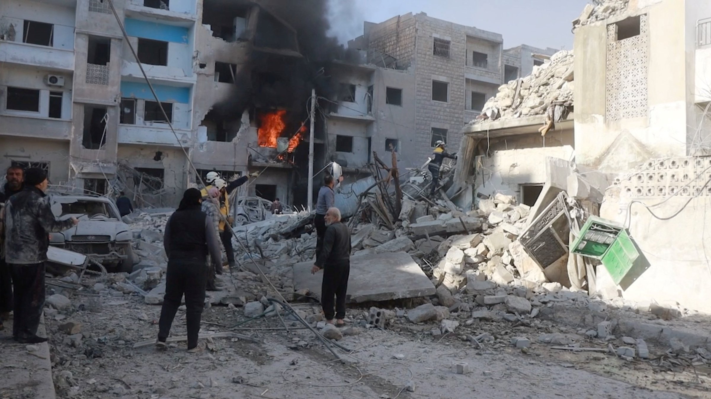 White Helmets members work next to a damaged building at the scene of what the organization says is a strike, at a location given as Idlib, Syria, released Dec. 2, 2024. (Reuters Photo)