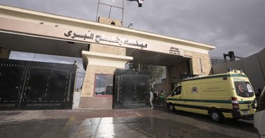 An Egyptian ambulance travels toward Gaza through the Rafah crossing port, Egypt, Nov.27, 2023. (AP Photo)