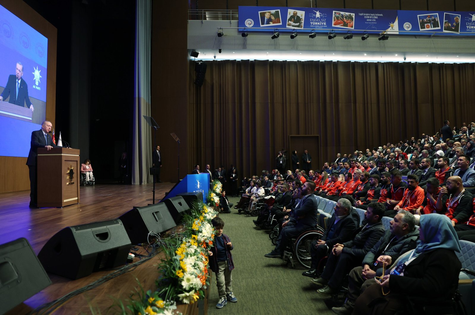 President Recep Tayyip Erdoğan (L) speaks at an event to mark the International Day of Persons with Disabilities in the capital, Ankara, Türkiye, Dec. 2, 2024. (AA Photo)