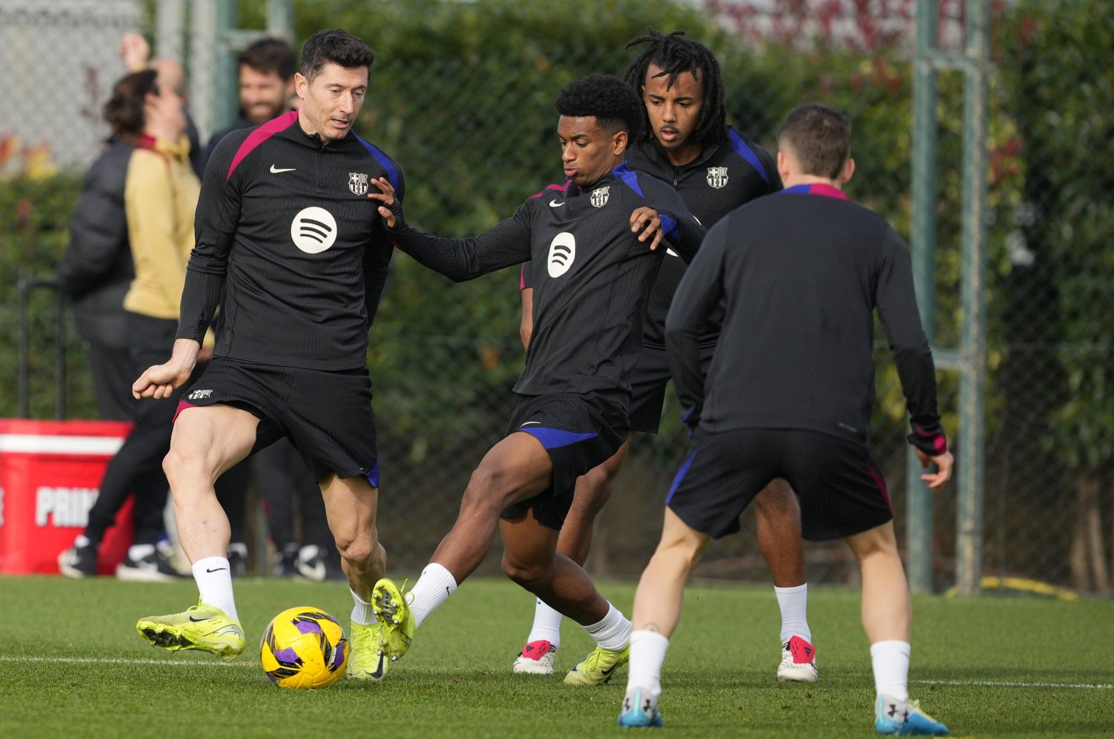 FC Barcelona&#039;s, Alejandro Balde (C) and Robert Lewandowski (L) in action during the team&#039;s training session at Joan Gamper Sports City, Barcelona, Spain, Dec. 2, 2024. (EPA Photo)