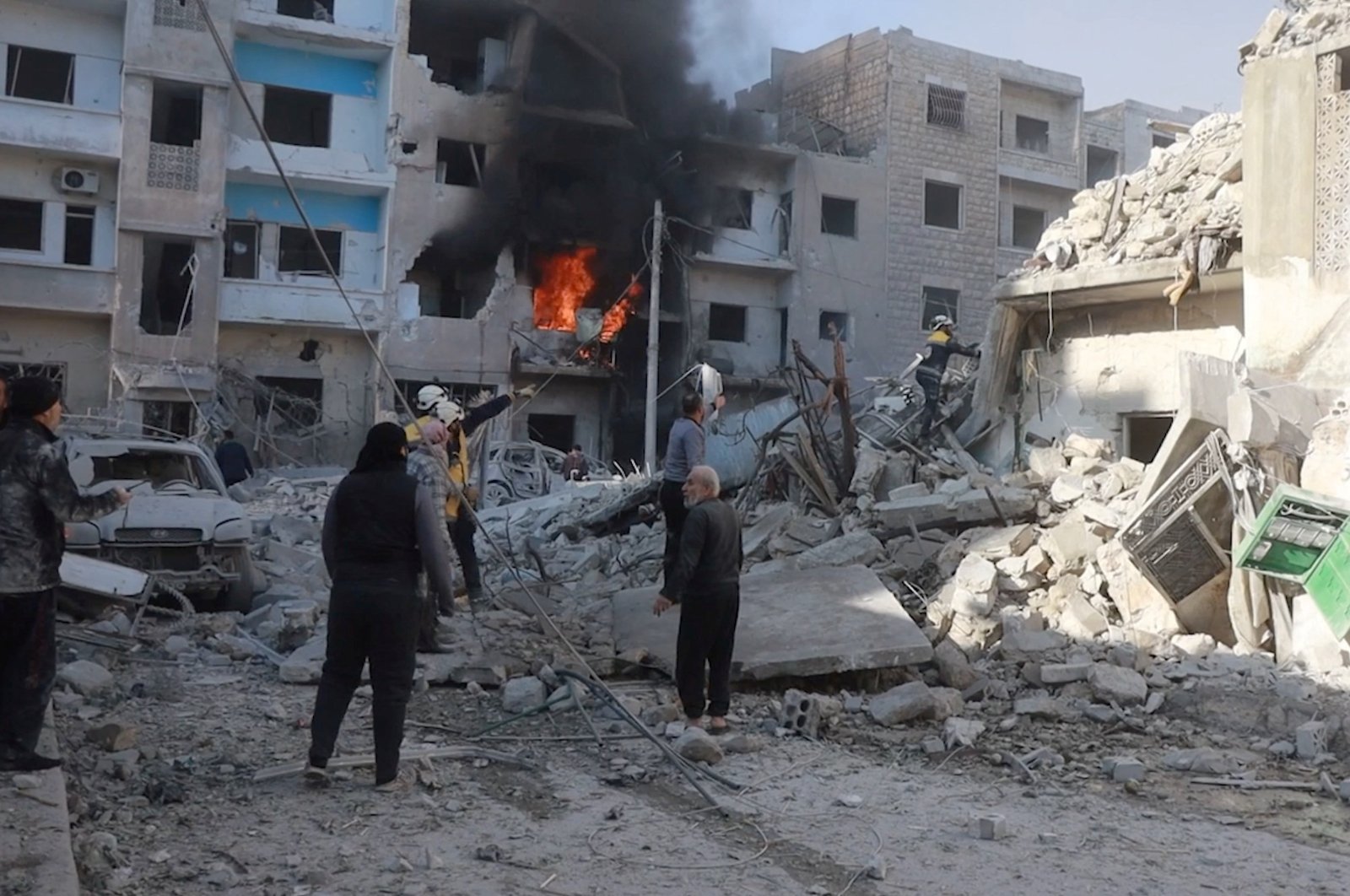 White Helmets members work next to a damaged building at the scene of what the organization says is a strike, at a location given as Idlib, Syria, released Dec. 2, 2024. (Reuters Photo)