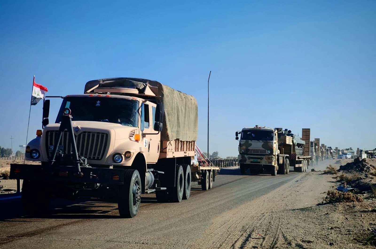 A handout picture released by Iraq&#039;s Defense Ministry shows Iraqi military equipment being transported toward the border with Syria on Dec. 2, 2024. (AFP Photo)