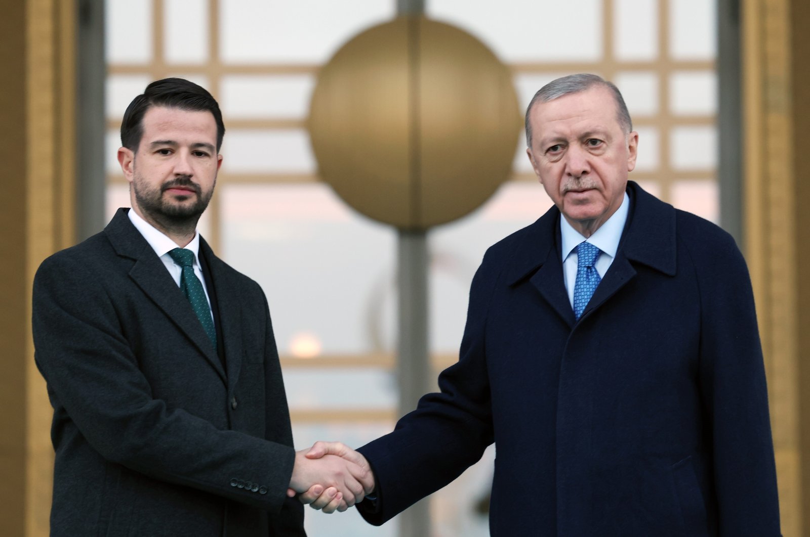 President Recep Tayyip Erdoğan and Montenegrin counterpart Jakov Milatovic shake hands at the Presidential Complex in Ankara, Dec. 2, 2024. (IHA Photo)