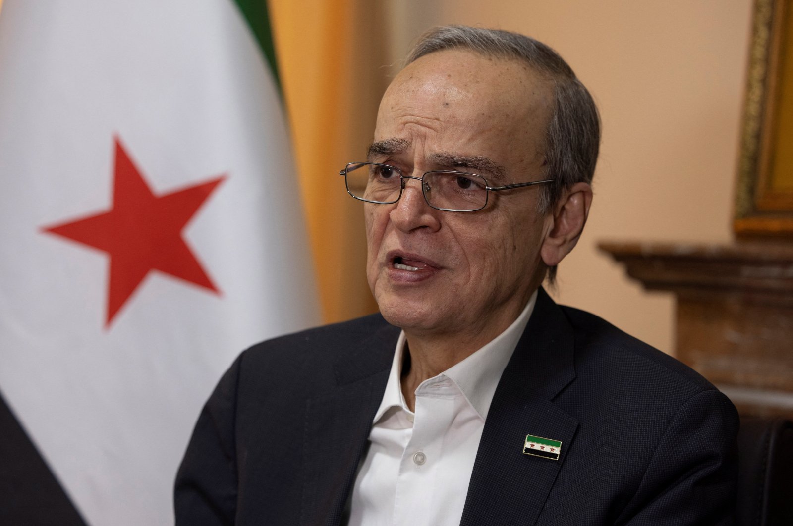 Hadi al-Bahra, president of the National Coalition of Syrian Revolution and Opposition Forces, speaks during an interview with Reuters in Istanbul, Dec. 2, 2024. (Reuters Photo)