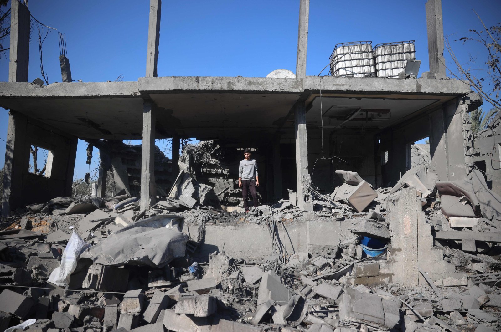 A Palestinian boy inspects the destruction at the site of an Israeli strike that targeted a house in the Bureij refugee camp in the central Gaza Strip, Dec. 2, 2024. (AFP Photo)