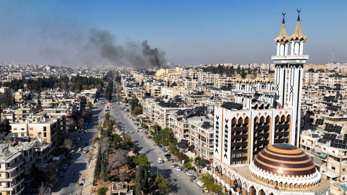 Smoke billows near residential buildings in a picture taken from a drone in Aleppo, Syria Dec.3, 2024. (Reuters Photo)