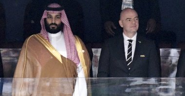 Saudi Arabia Crown Prince Mohammed bin Salman (L) and FIFA President Gianni Infantino, stand for the anthem prior to the match between Russia and Saudi Arabia which opened the 2018 World Cup at the Luzhniki stadium, Moscow, Russia, June 14, 2018. (AP Photo)