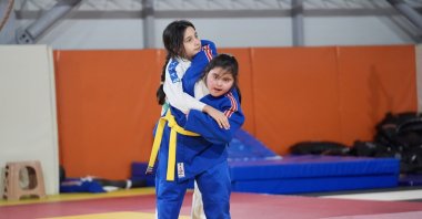 11-year-old judoka with Down syndrome Melisa Özcan (R) spars with her friend, Düzce, Türkiye, Dec. 3, 2024. (AA Photo)