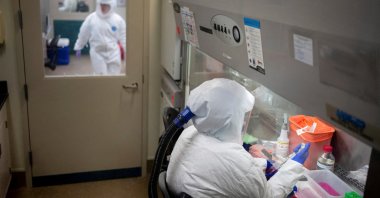 Employees work in a biosafety-level 3 lab at the Tulane National Primate Research Center, where they have shifted the focus of their studies to COVID-19 pandemic, Covington, Louisiana, U.S., May 14, 2021. (Reuters Photo)