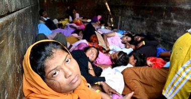  Rohingya refugees sit on a truck after being relocated from Southern Aceh province to Banda Aceh, Nov. 7, 2024. (AFP Photo)