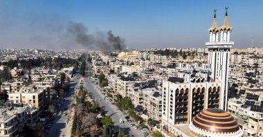 Smoke billows near residential buildings in a picture taken from a drone in Aleppo, Syria Dec.3, 2024. (Reuters Photo)