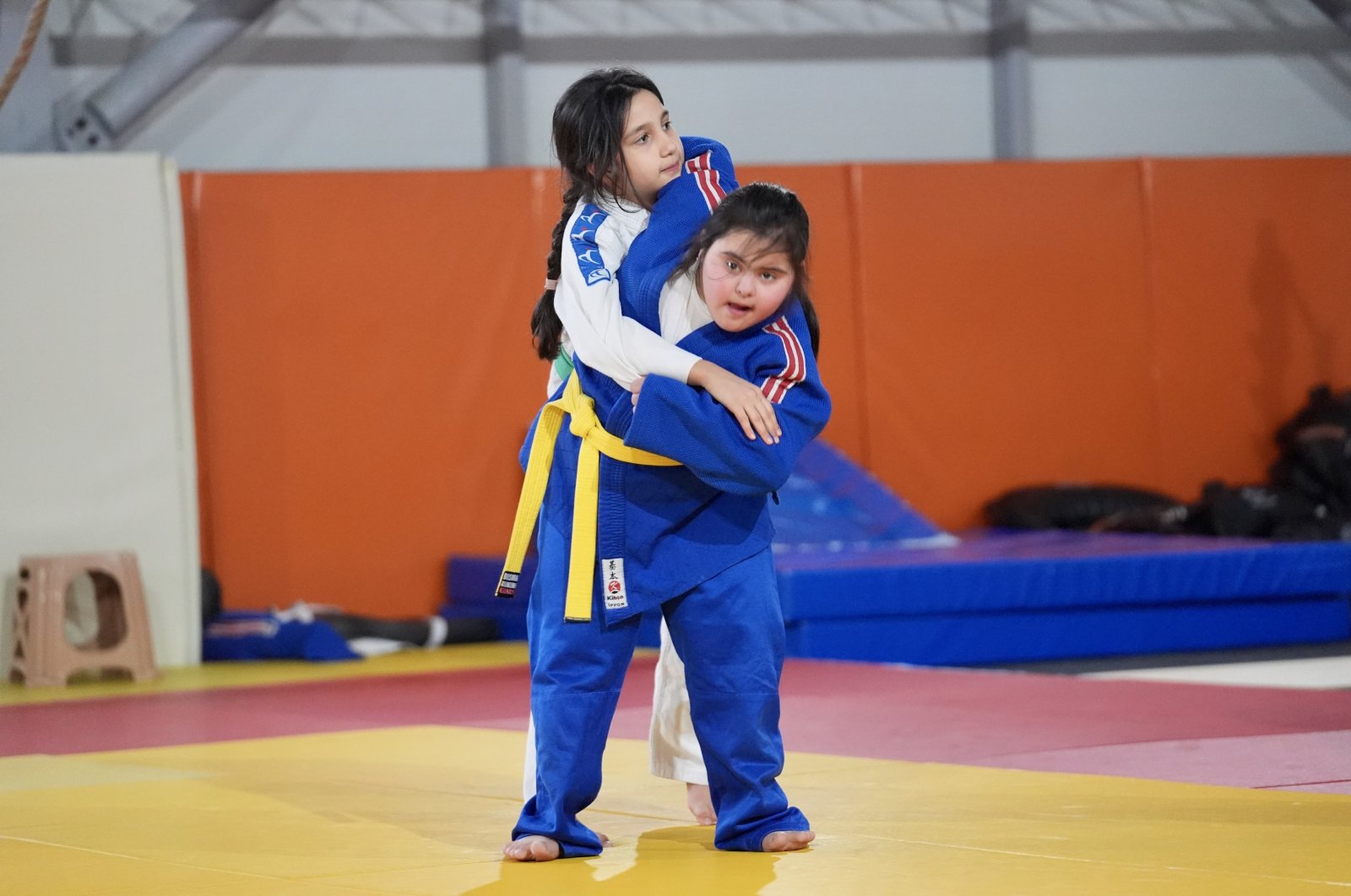 11-year-old judoka with Down syndrome Melisa Özcan (R) spars with her friend, Düzce, Türkiye, Dec. 3, 2024. (AA Photo)