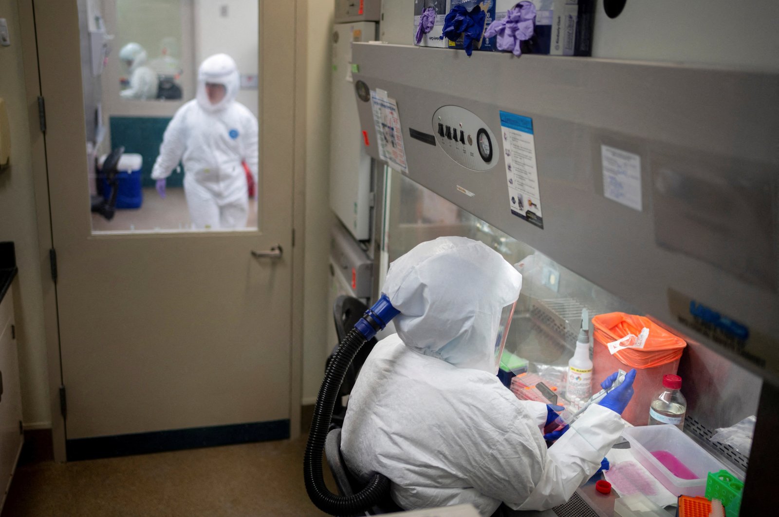 Employees work in a biosafety-level 3 lab at the Tulane National Primate Research Center, where they have shifted the focus of their studies to COVID-19 pandemic, Covington, Louisiana, U.S., May 14, 2021. (Reuters Photo)