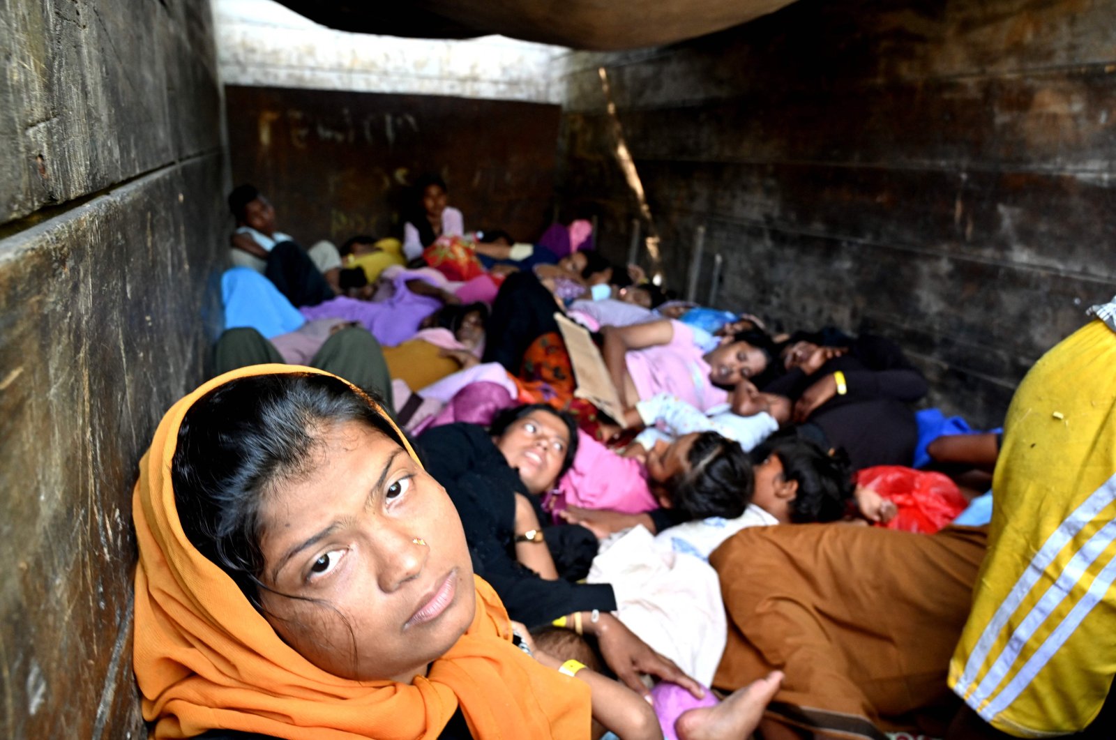  Rohingya refugees sit on a truck after being relocated from Southern Aceh province to Banda Aceh, Nov. 7, 2024. (AFP Photo)