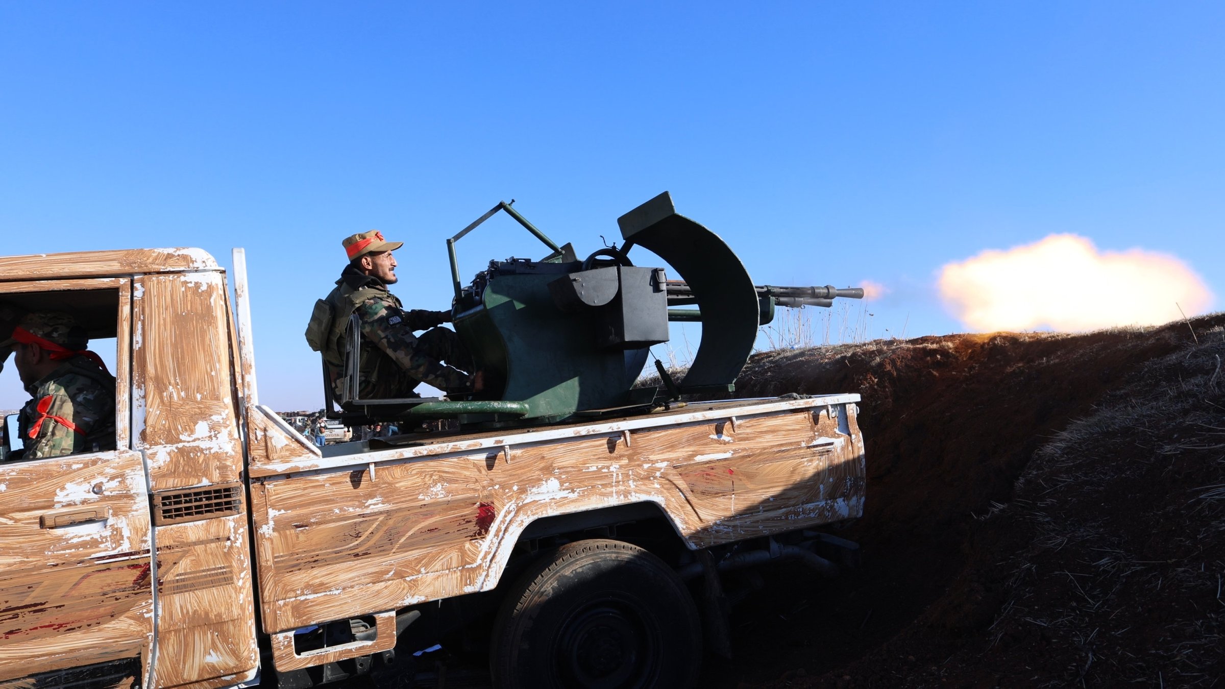 Syrian National Army (SNA) members fire at PKK/YPG positions near Tal Rifaat, Syria, Dec. 1, 2024. (AA Photo)