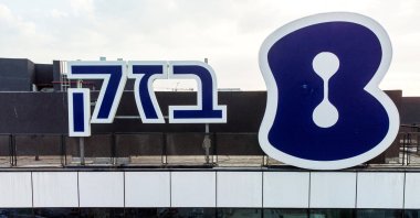 The logo of Bezeq Israeli Telecommunication Corp Ltd., the country&#039;s largest telecom group, is seen outside their headquarters, Holon, Israel, Oct. 23, 2022. (Reuters Photo)