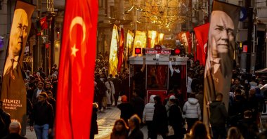 A tramway passes through people on the famous Istiklal Avenue in Istanbul, Türkiye, Nov. 10, 2024. (AFP Photo)