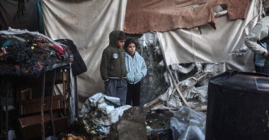 Displaced Palestinian children inspect makeshift camp damaged in Israeli strikes, Bureij refugee camp, central Gaza, Palestine, Dec. 4, 2024. (AFP Photo)