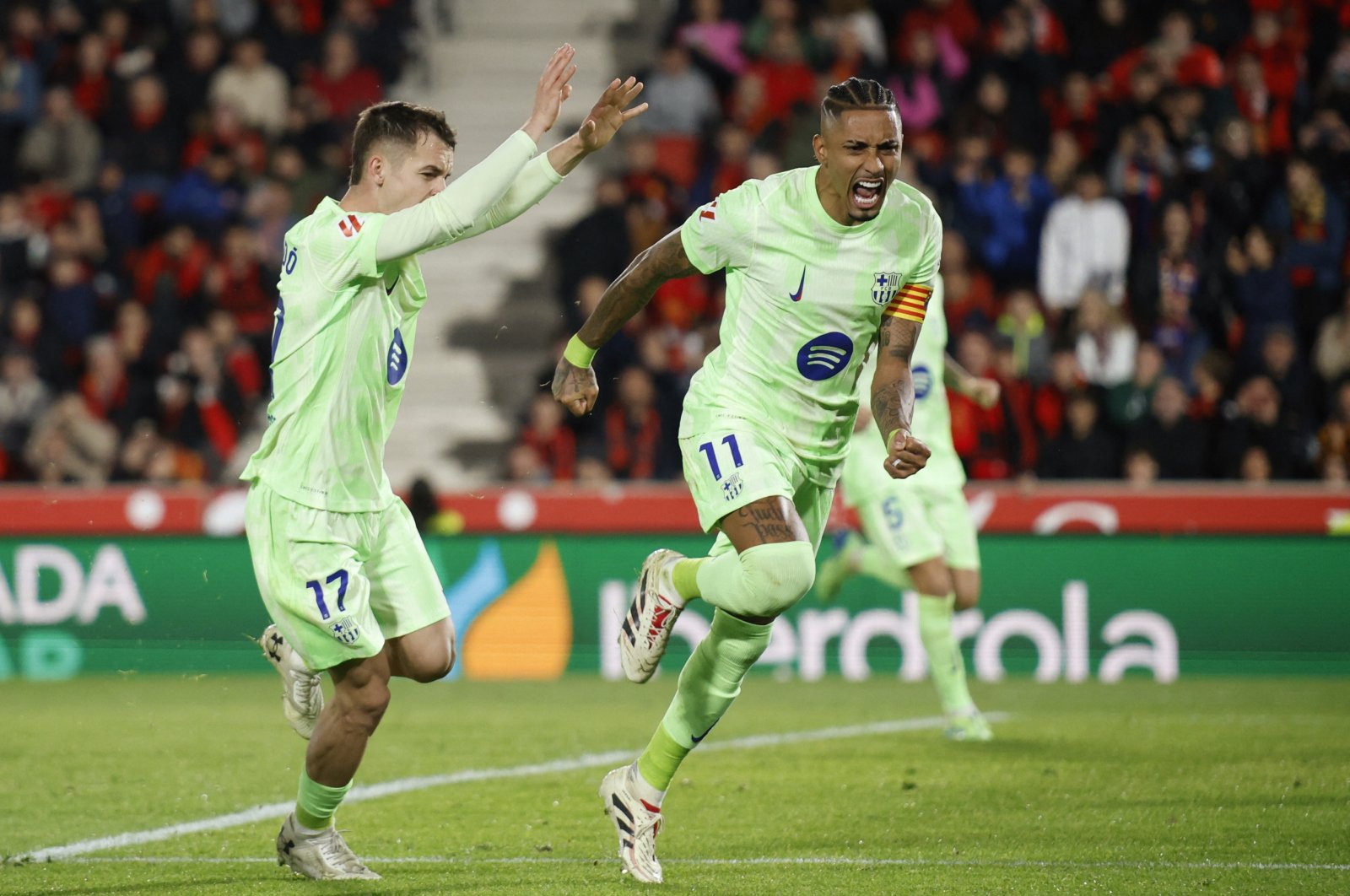 FC Barcelona&#039;s Raphinha celebrates scoring their second goal with Marc Casado during the La Liga RCD Mallorca versus FC Barcelona match, Palma, Mallorca, Spain, Dec. 3, 2024. (Reuters Photo)