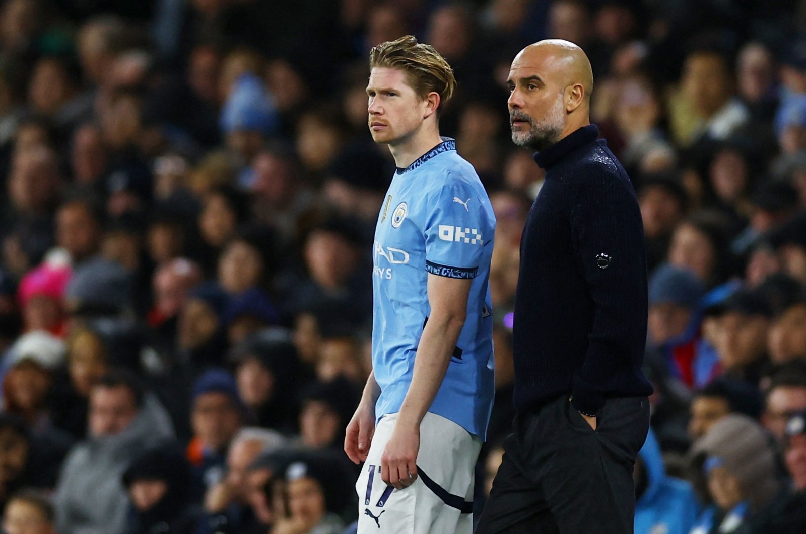 Manchester City manager Pep Guardiola (R) stands with Kevin De Bruyne as he prepares to come on as a substitute during the Premier League against Tottenham Hotspur at the Etihad Stadium, Manchester, U.K., Nov. 23, 2024. (Reuters Photo)