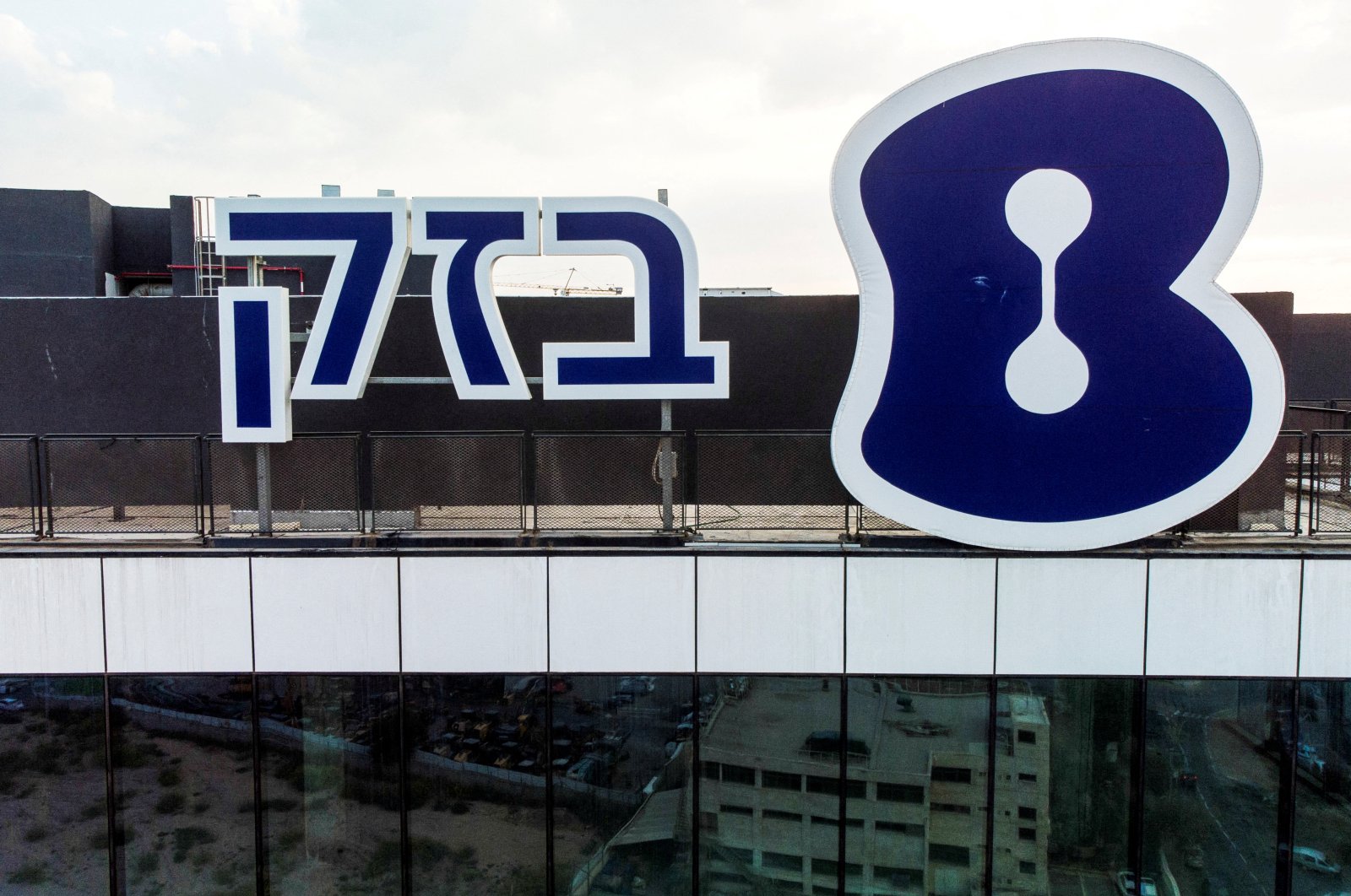 The logo of Bezeq Israeli Telecommunication Corp Ltd., the country&#039;s largest telecom group, is seen outside their headquarters, Holon, Israel, Oct. 23, 2022. (Reuters Photo)