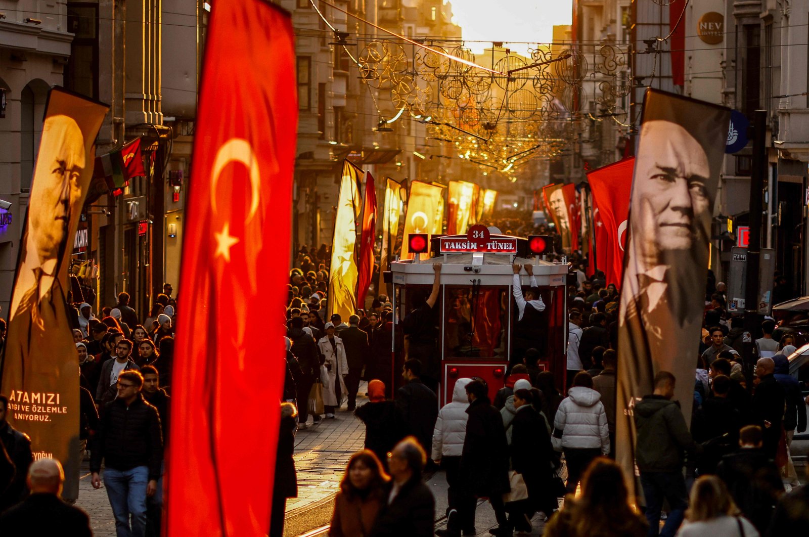 A tramway passes through people on the famous Istiklal Avenue in Istanbul, Türkiye, Nov. 10, 2024. (AFP Photo)