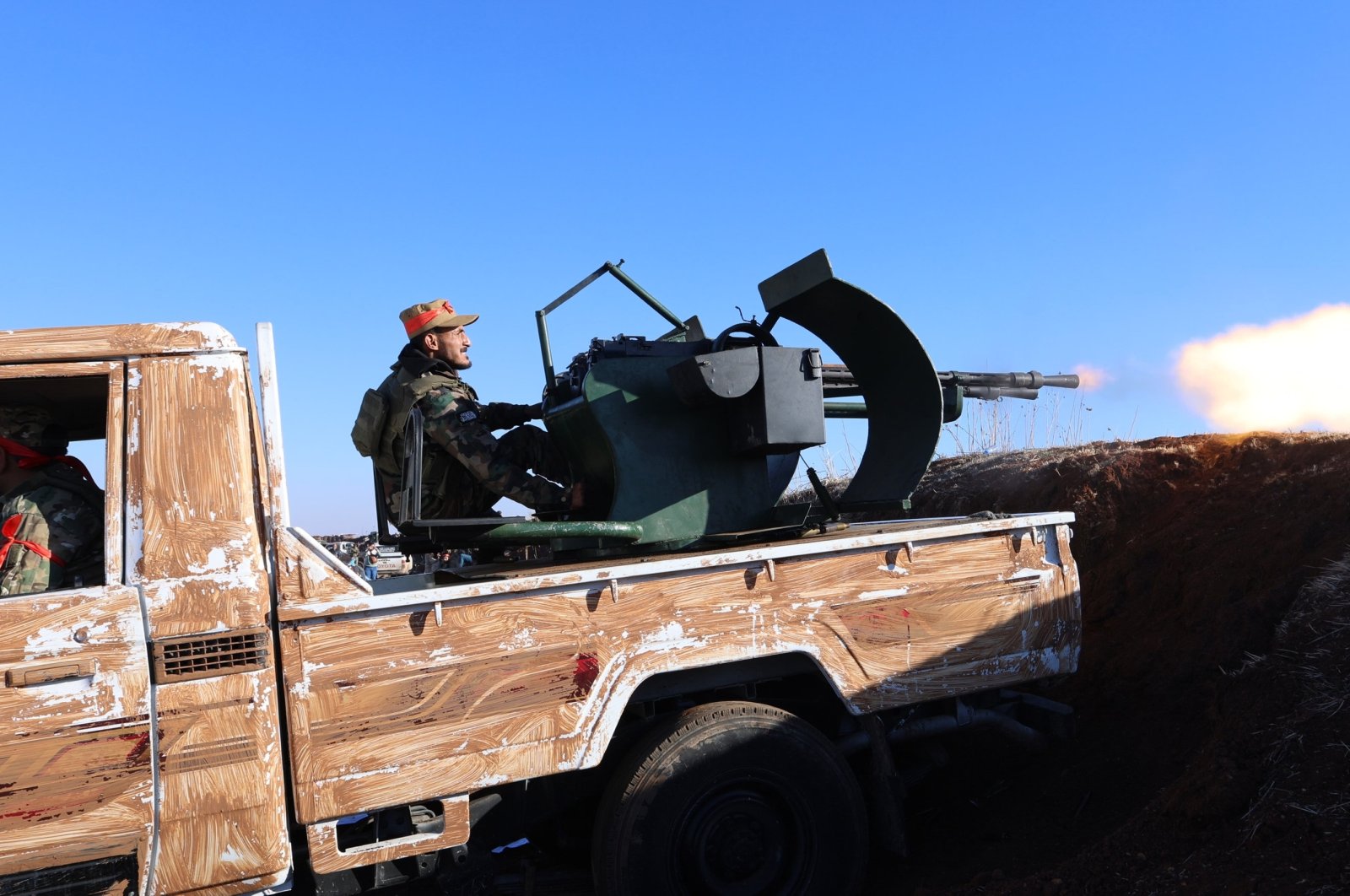 Syrian National Army (SNA) members fire at PKK/YPG positions near Tal Rifaat, Syria, Dec. 1, 2024. (AA Photo)