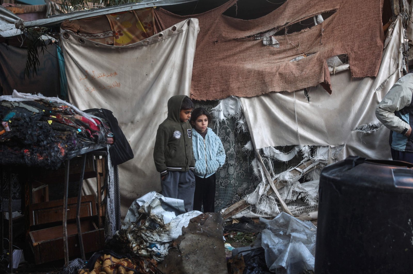 Displaced Palestinian children inspect makeshift camp damaged in Israeli strikes, Bureij refugee camp, central Gaza, Palestine, Dec. 4, 2024. (AFP Photo)