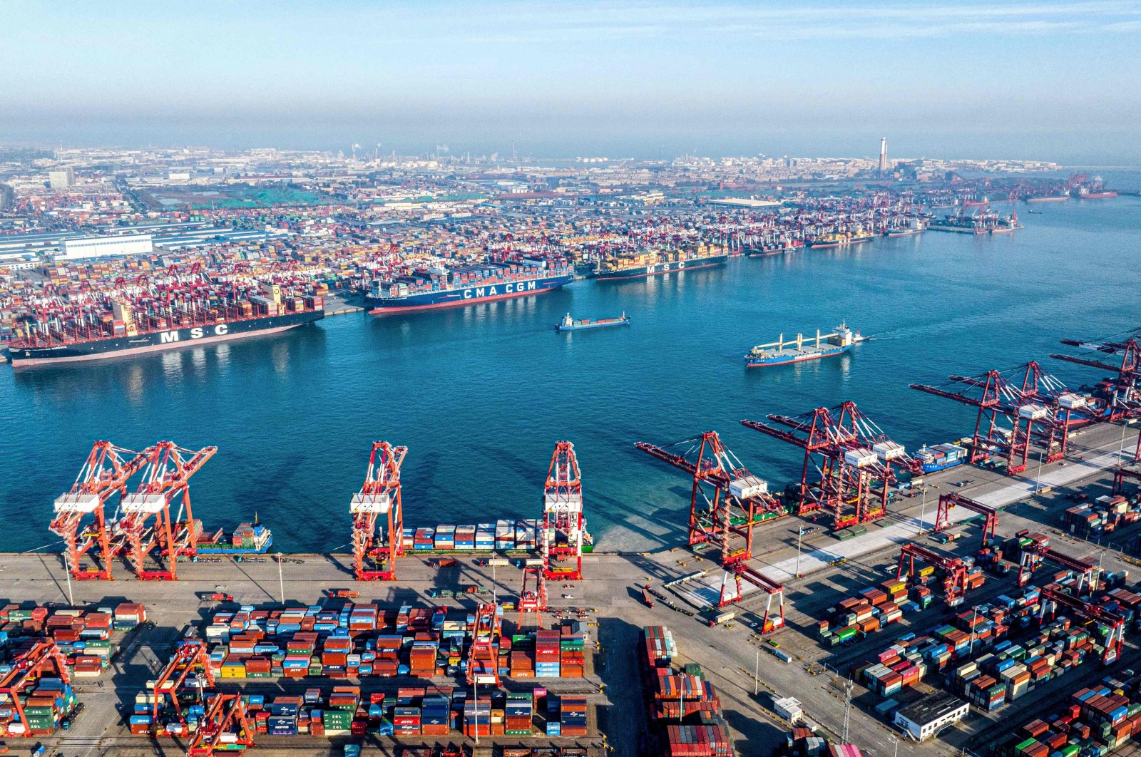 Shipping containers and gantry cranes are seen at Qingdao port in Qingdao, in eastern China&#039;s Shandong province, Dec. 4, 2024. (AFP Photo)