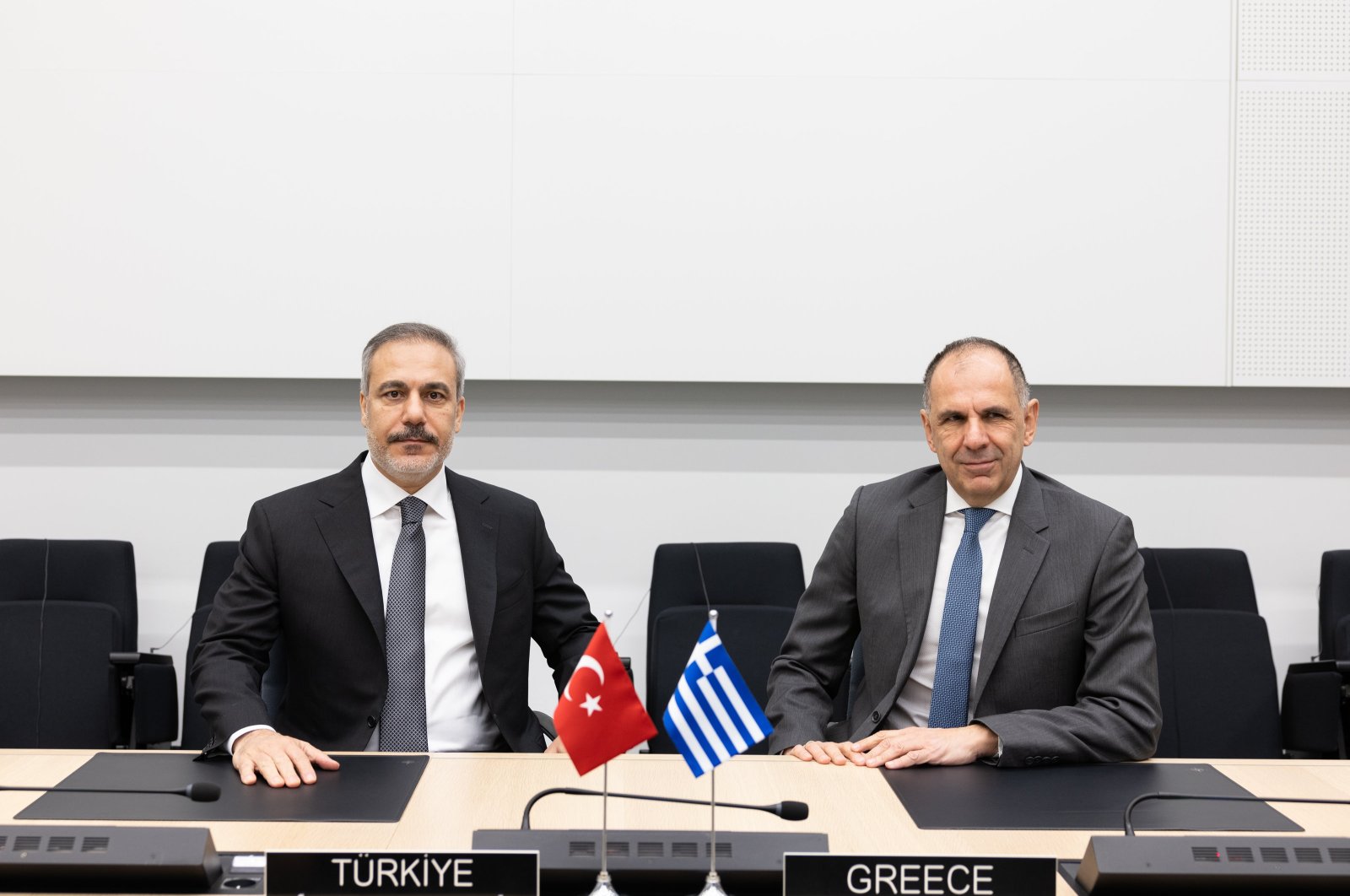 Foreign Minister Hakan Fidan and his Greek counterpart Giorgos Gerapetritis meet on the sidelines of a NATO meeting, Brussels, Belgium, Dec. 4, 2024. (AA Photo)