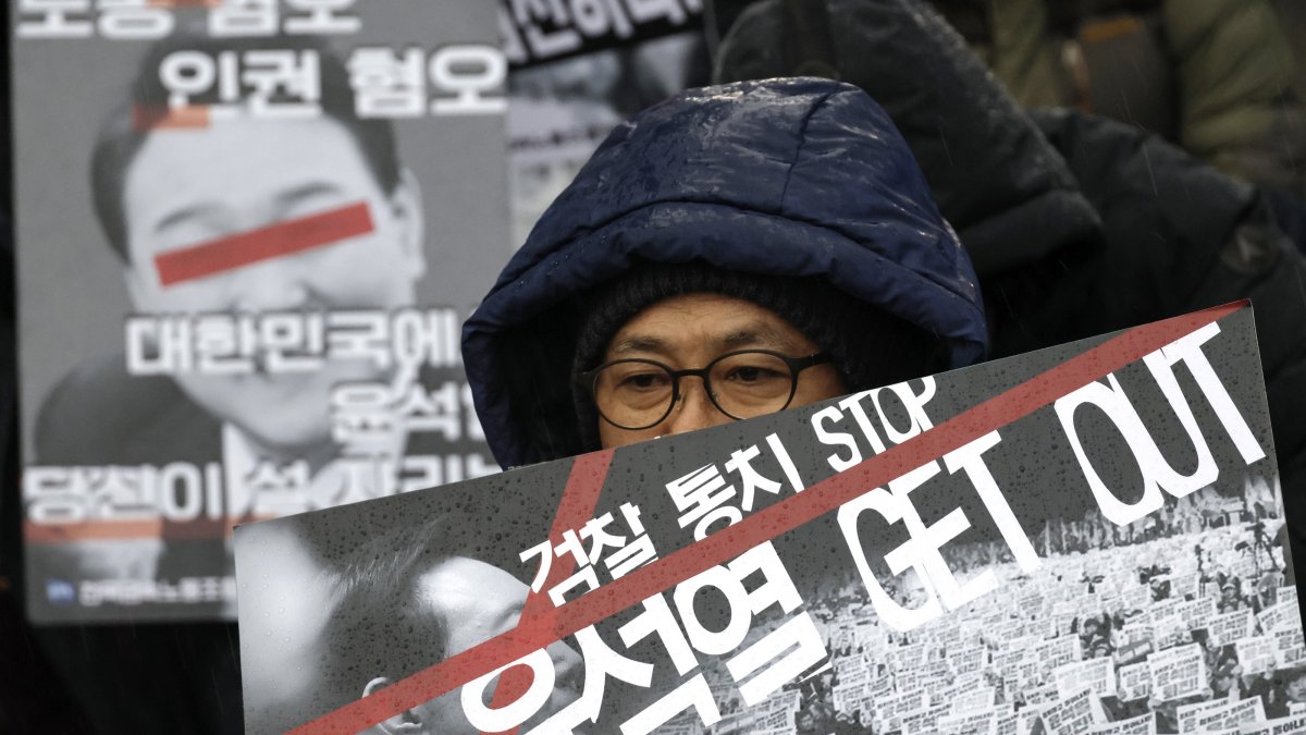 Protesters hold placards reading &#039;Yoon, get out&#039; during a demonstration calling for the dismissal and impeachment of South Korean president in Seoul, South Korea, Dec. 5, 2024. (EPA Photo)