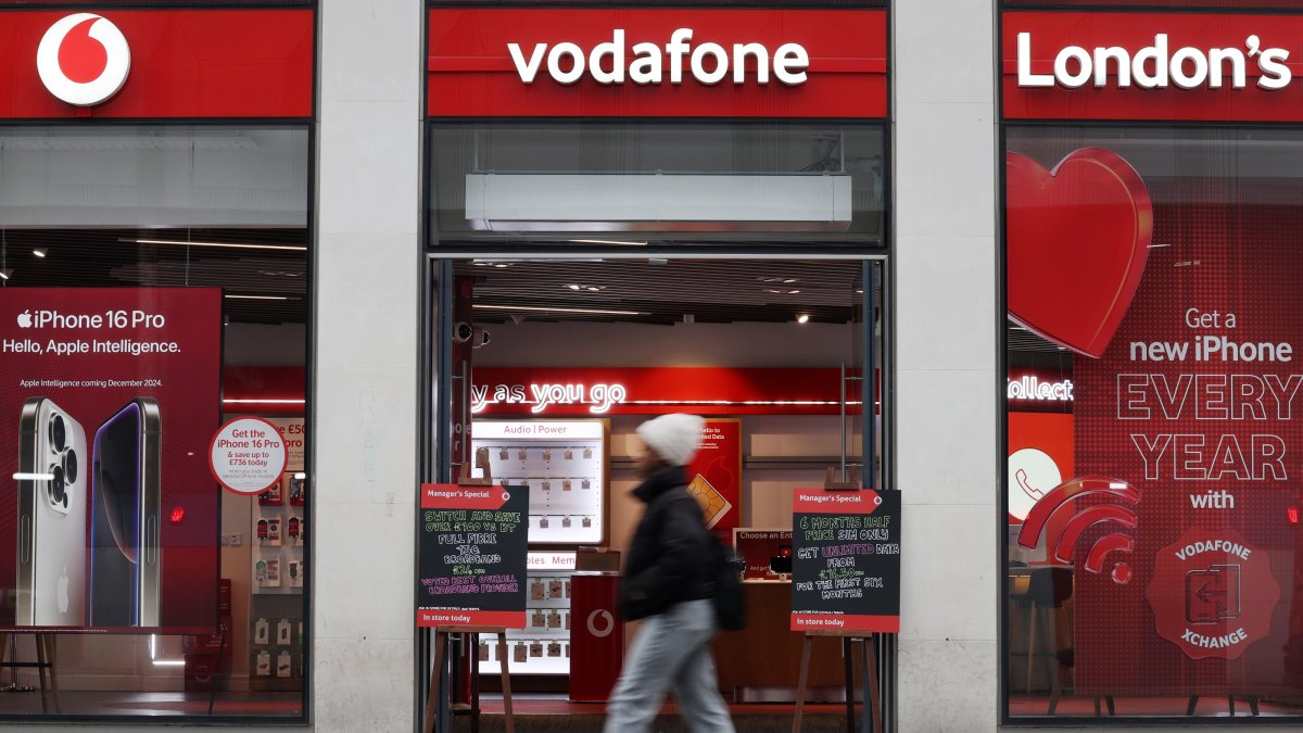A pedestrian passes by a Vodafone mobile store in London, U.K., Nov. 5, 2024. (EPA Photo)