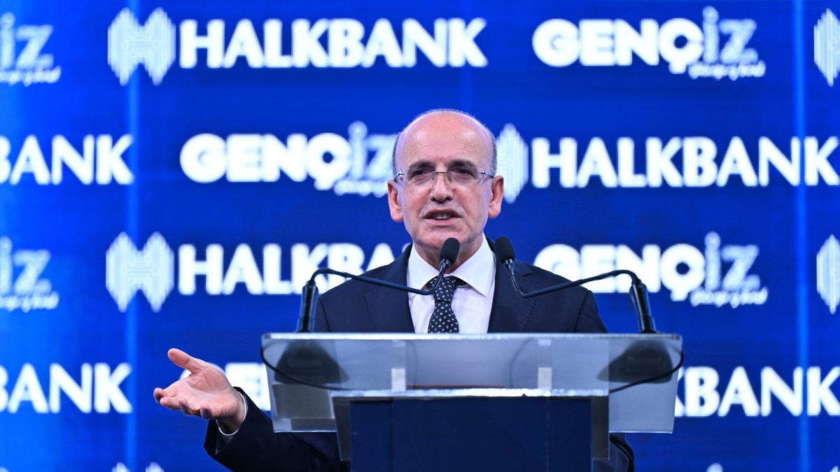 Treasury and Finance Minister Mehmet Şimşek delivers a speech at an event organized by Halkbank, Istanbul, Türkiye, Dec. 4, 2024. (AA Photo)