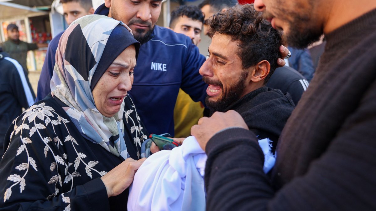 A woman reacts as she checks the body of a 2-year-old child who was killed in an Israeli airstrike in Gaza City, central Gaza, Palestine, Dec. 5, 2024. (AFP Photo)