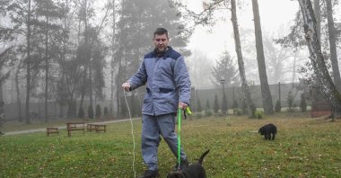 Prisoner Marek Kolar walks with an 8-week-old dog puppy named Zirkon at the prison in Jirice, near Prague, Czechia, Nov. 27, 2024. (AFP Photo)