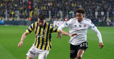 Fenerbahçe's Mert Hakan (L) and Gedson Fernandes vie for the ball during the Süper Lig match at the Ülker Stadium, Istanbul, Türkiye, April 27, 2024. (IHA Photo)