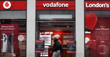 A pedestrian passes by a Vodafone mobile store in London, U.K., Nov. 5, 2024. (EPA Photo)