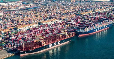 Cargo ships and containers are seen at Qingdao port in Qingdao in eastern China's Shandong province, Dec. 4, 2024. (AFP Photo)