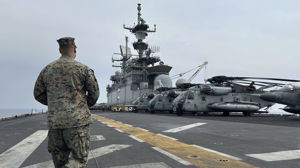 A marine walks on the deck of the amphibious assault ship USS Bataan that is docked at Larnaca port, Greek Cypriot administration, Feb. 13, 2024. (AP Photo)