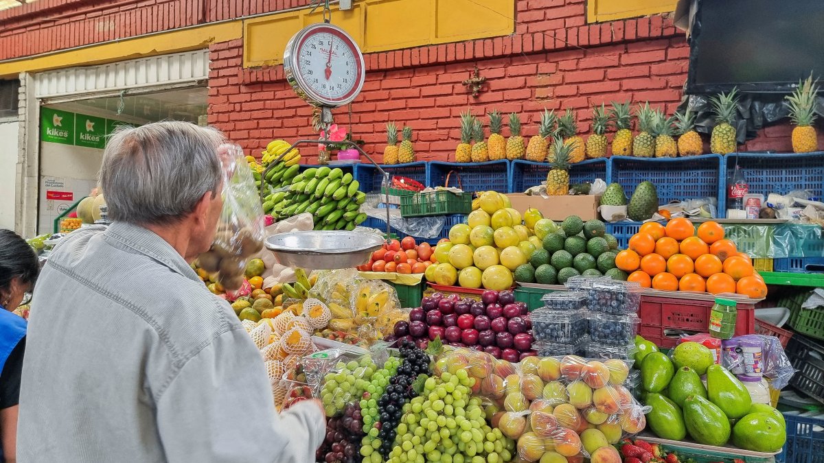 A person sells food in a market square, Bogota, Colombia, Dec. 1, 2024. (Reuters Photo)