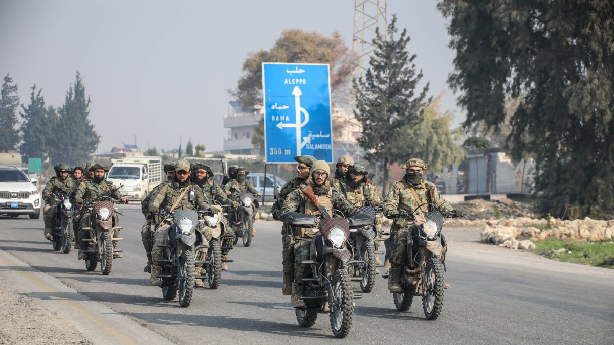 Anti-regime fighters ride motorbikes into the center of Homs city, after seizing several towns around it, during their advance, Homs, Syria, Dec. 6, 2024. (AA Photo)