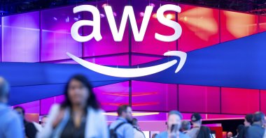 Attendees walk through an expo hall at AWS re:Invent 2024, a conference hosted by Amazon Web Services, Las Vegas, U.S., Dec. 4, 2024. (AP Photo)
