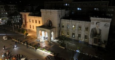 A drone view shows people gathering in front of Hama governor&#039;s building with an image of Syrian President Bashar Assad after anti-regime forces captured the city during their advance across northern Syria, in Hama, Syria, Dec. 5, 2024. (Reuters Photo)