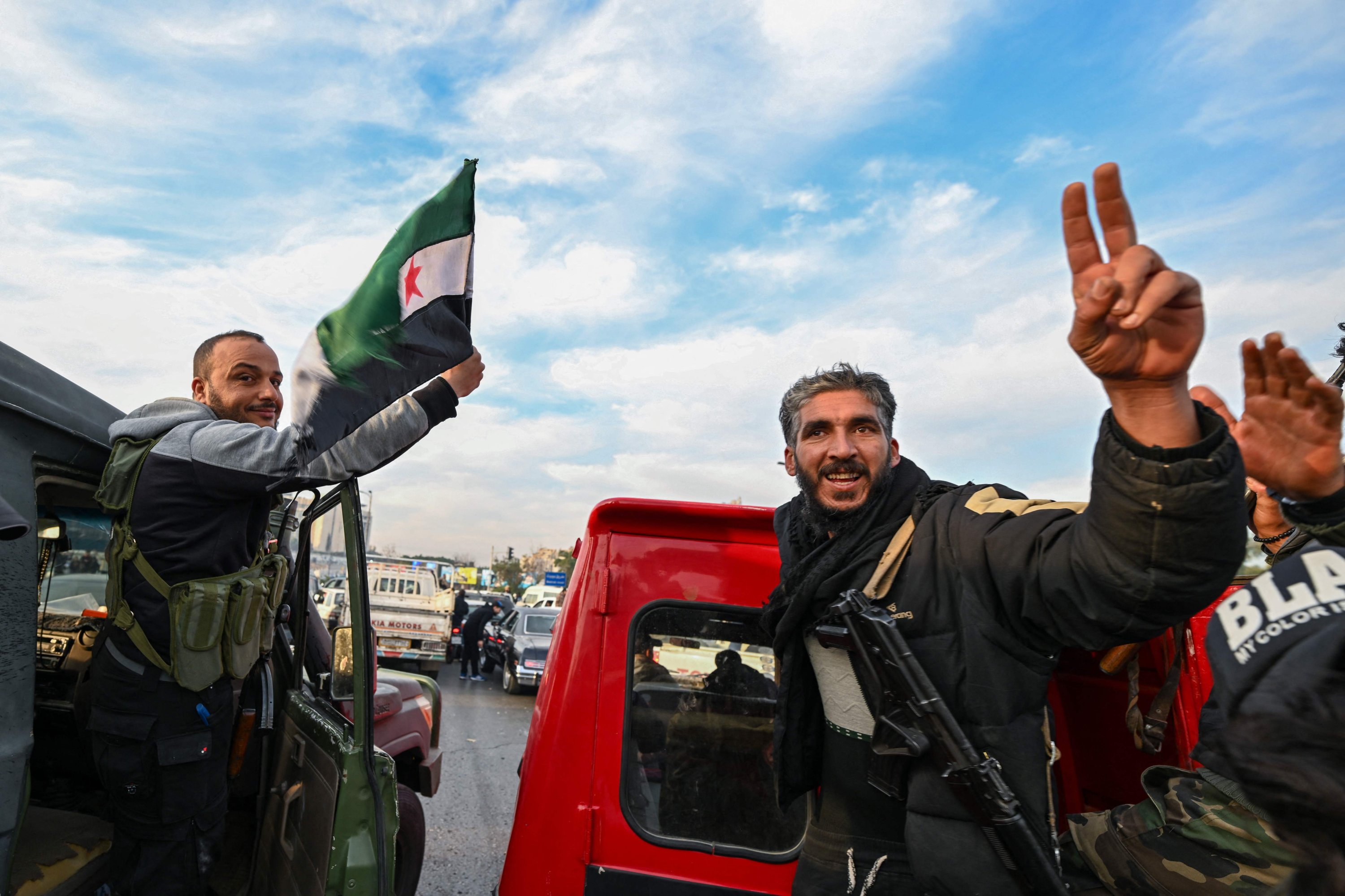 Anti-regime fighters celebrate at Umayyad Square in Damascus, Syria, Dec. 8, 2024. (AFP Photo)