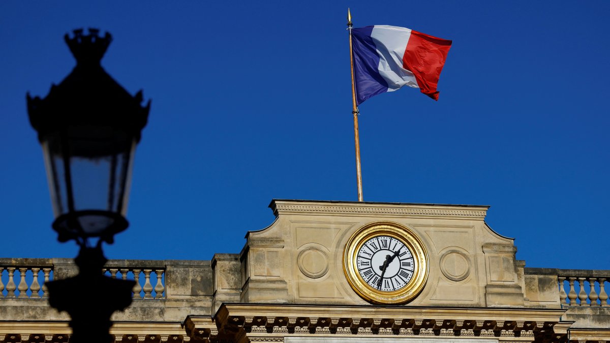 A French national flag flies over the National Assembly in Paris, France, Nov. 28, 2024. (Reuters Photo)